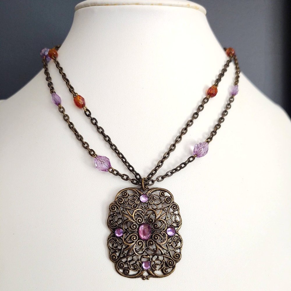 Orange and purple beaded necklace with filigree pendant
